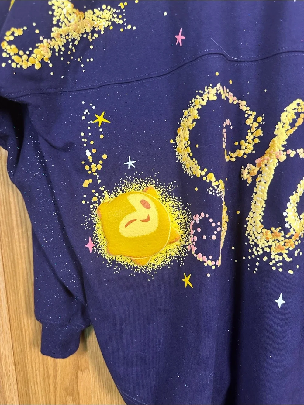 Disney Navy Crewneck Sweatshirt with Yellow Starburst Graphic